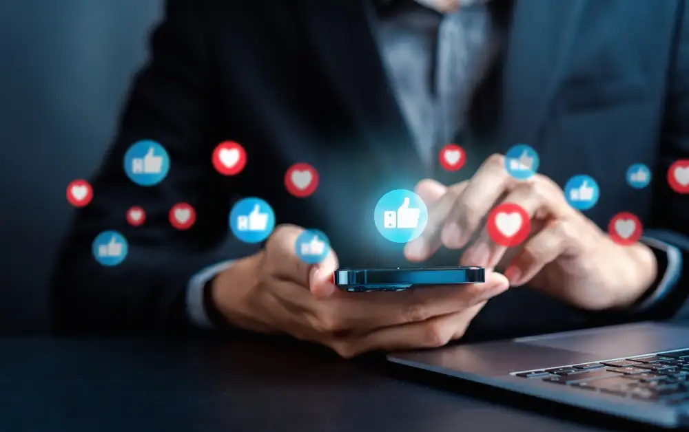 Digital marketing restaurants can immediately feel like a nice-to-have instead of what it really is, which is a must-have, as shown in this image of a restaurant owner looking at smart phone with digital marketing strategy icons.