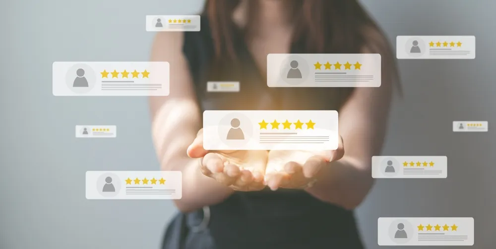 Conceptual image of a woman with her palms facing up, surrounded by floating review icons with star ratings. This represents the impact of Google Reviews and Yelp on restaurant sales.