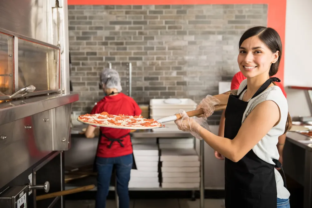A behind-the-scenes look at a chef preparing food in a restaurant kitchen. TikTok digital marketing for restaurants can include showcasing how food is made.