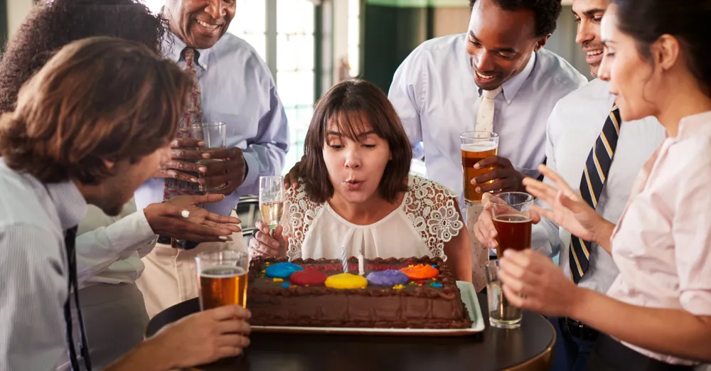 Restaurant staff participate in celebrating a customer's birthday. Digital marketing on TikTok for restaurants can include showcasing customers' reactions.