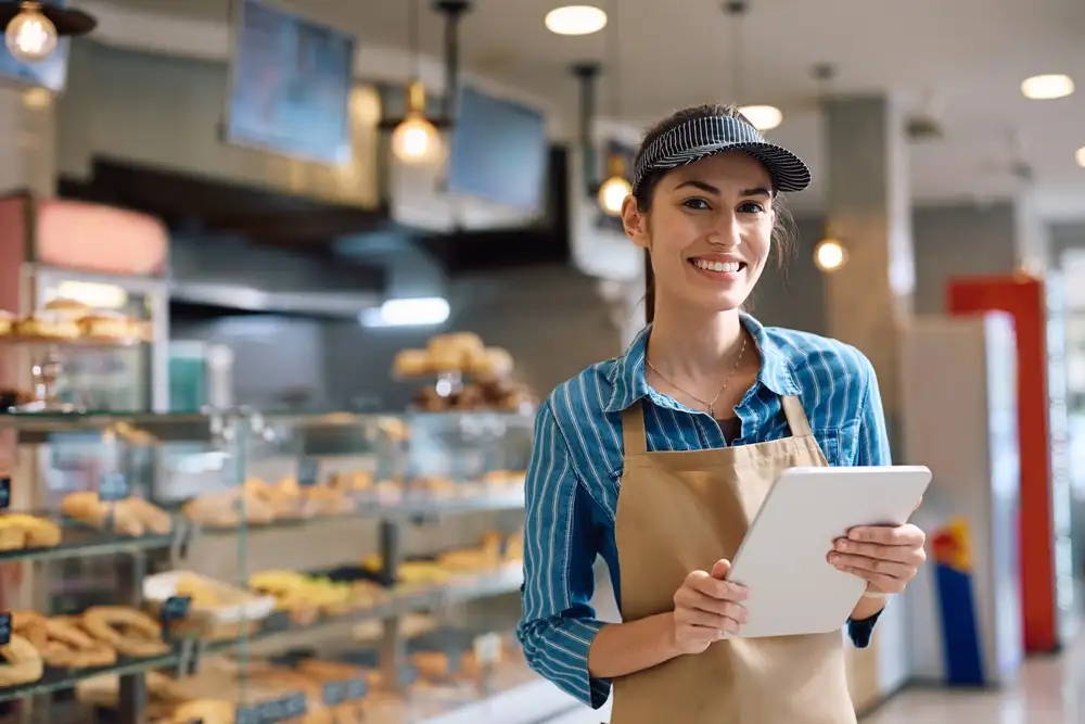 Digital marketing on Twitter / X should be a part of your restaurant's digital marketing strategy. As shown in this image of a bakery owner smiling at the increased sales brought through her X account.