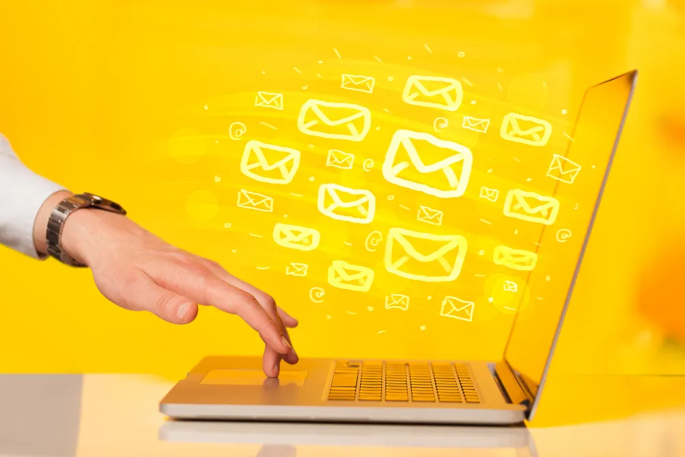 Graphic of a user clicking on a laptop and sending emails to his email list. Avoid sending broadcast emails when doing restaurant email marketing.