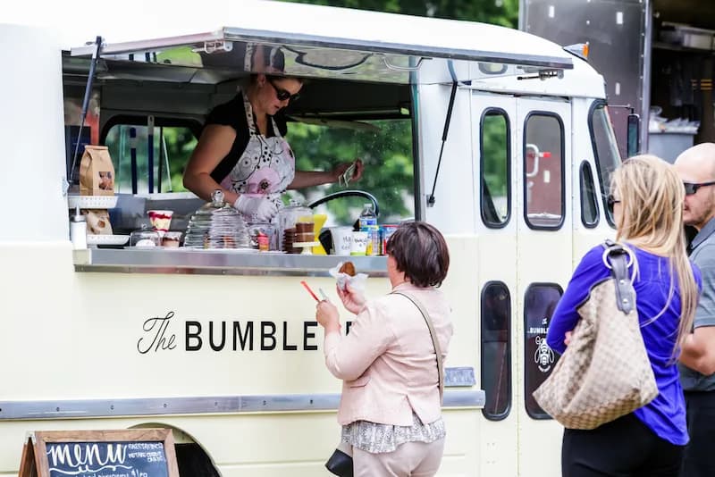 The Bumble Bee food truck in Denver, Colorado serves up delicious food to hungry customers.