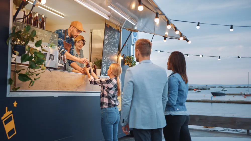 A couple placing an order at one of many popular Miami food trucks.