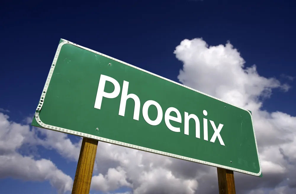 A highway sign that says Phoenix. Food truck business in Phoenix AZ is your next destination.
