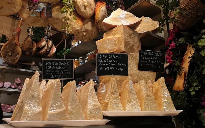 A market in Florence, Italy, that is selling Parmigiano Reggiano cheese.
