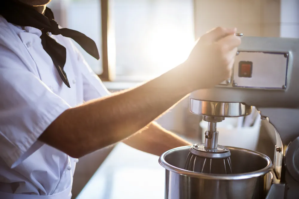 A commercial kitchen stand mixer. Buying used commercial kitchen equipment like this stand mixer can save you money when opening a new restaurant.