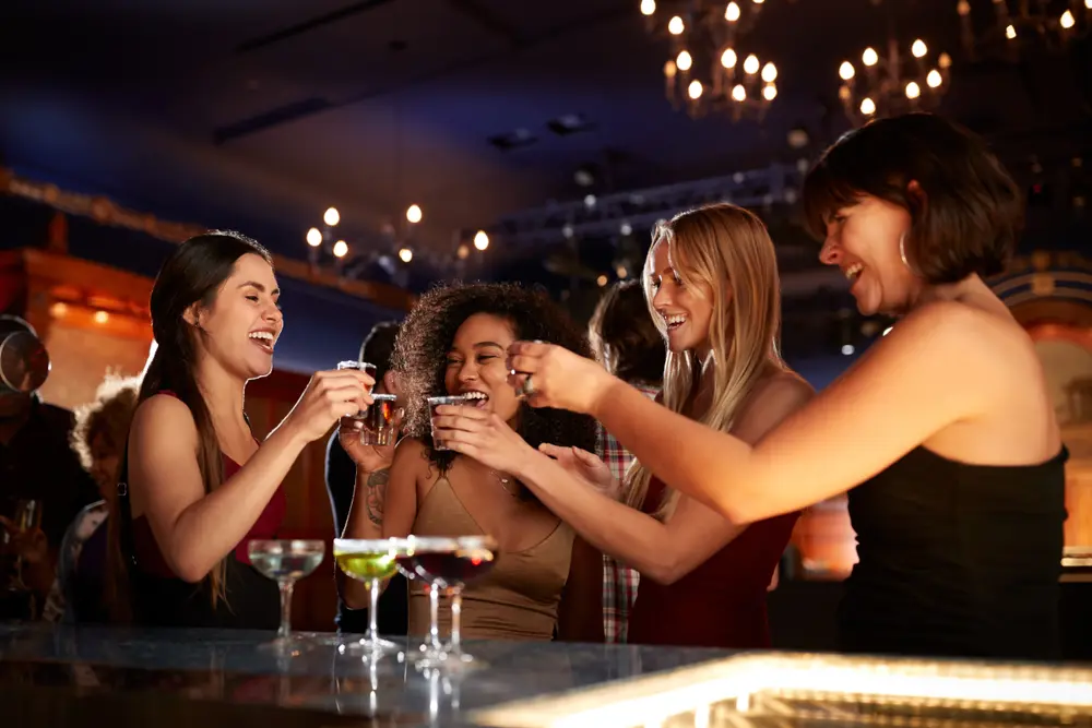 Women night's out with cocktails. Mixology is the art of making cocktails and mixed drinks, as shown in this image of a group of women enjoying cocktails that were prepared by an ultimate mixologist.