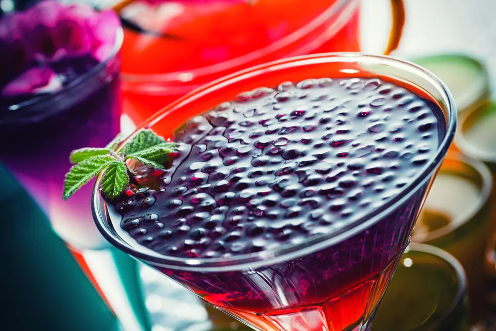 Mixology makes use of fresh ingredients, unique flavors, and creative techniques to create cocktails that are visually appealing and delicious. As shown in this image of a cocktail with vibrant colors and undoubtedly unique flavors.