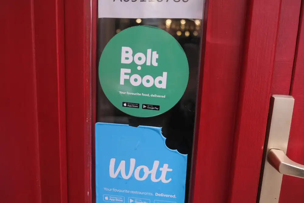 The food delivery app UK Bolt and Wolt are two of the best food delivery apps for a restaurant in Europe. As shown in this image of a Bolt and Wolt advertisement in a restaurant in London, UK.