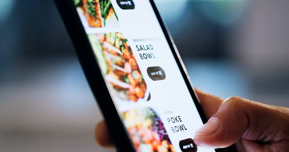 Knowing how much do food delivery apps charge restaurants is important. As shown in this image of a food delivery app being used to order food in London, UK.