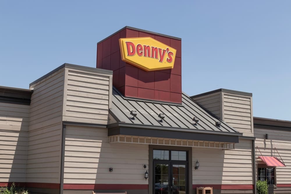 An updated Denny's Diner restaurant. The yellow and red sign outside the restaurant continues to be a recognizable symbol of the diner.