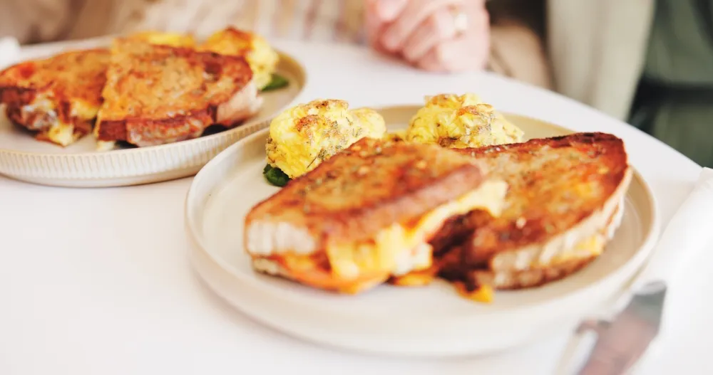 A ham and eggs based sandwich. Breakfast items like the Grand Slam have become Denny's Diner's signature menu items, contributing to customer loyalty over the years.