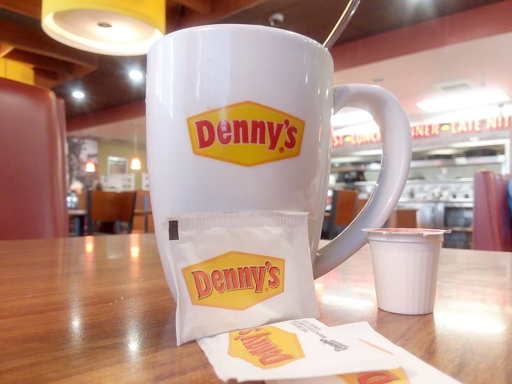 The familiar Denny's coffee mug. Denny's Diner has been serving coffee since its founding in 1953.